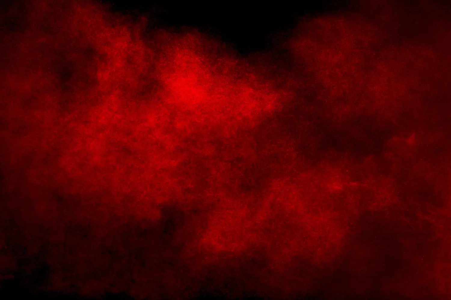 Wing Chun, Art of the Warrior - Rote Pulver Explosion Wolke auf schwarzem Hintergrund.